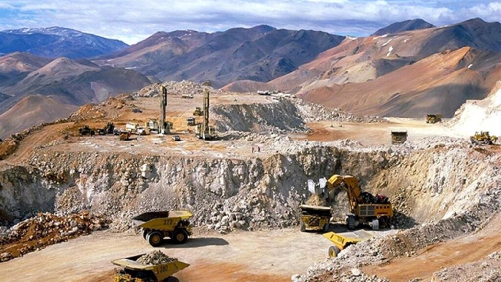 a construction site with mountains in the background